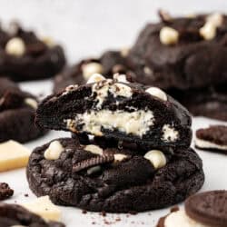 half of a cookie sitting on top of a whole cookie