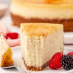 slice of creme brulee cheesecake on a plate with a forkful missing