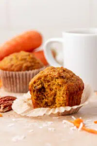 carrot cake muffin with a bite taken out of it