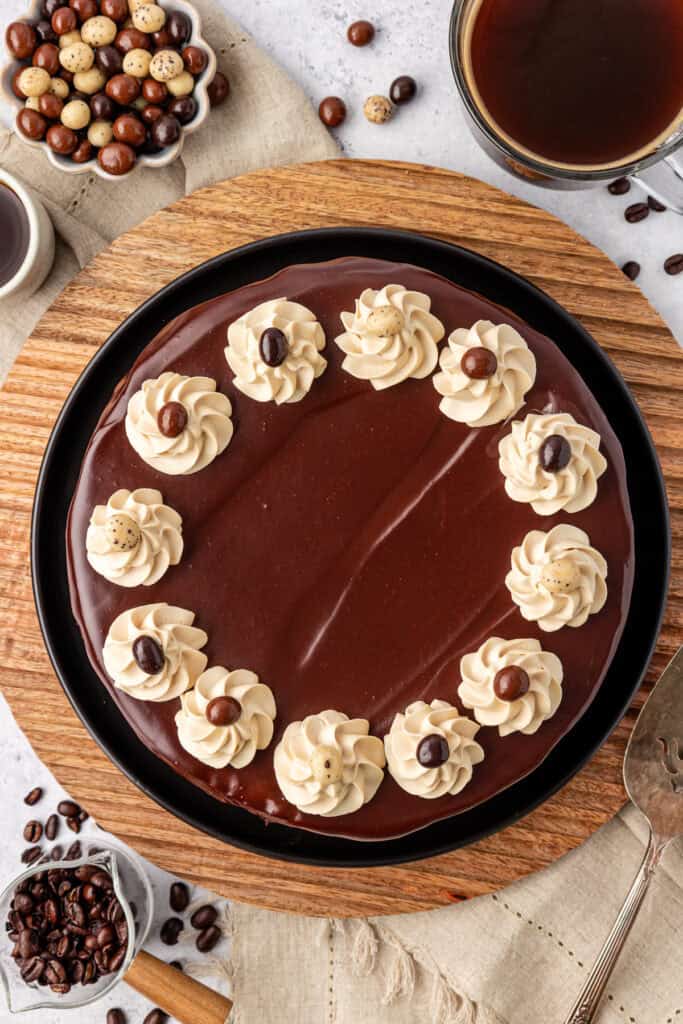 whole espresso cheesecake topped with whipped cream