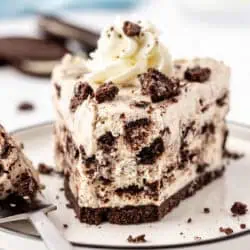 slice of no bake oreo cheesecake with a bite missing