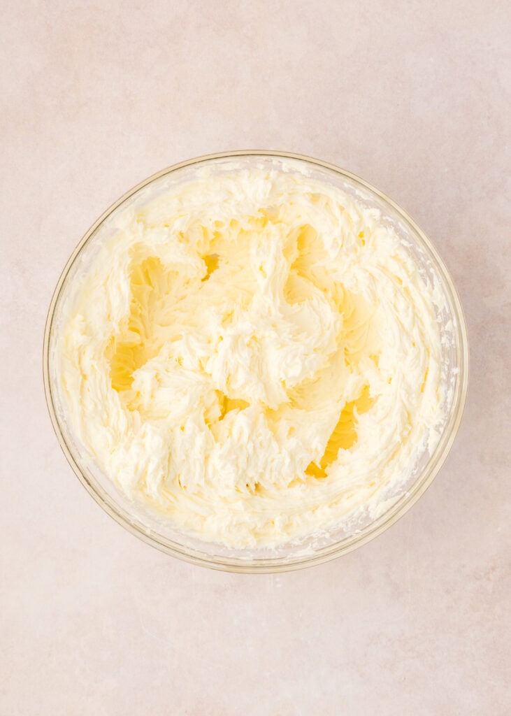 cream cheese and sugar beaten in a bowl