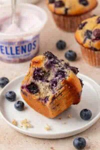 blueberry greek yogurt muffin on a plate with a bite taken out of it