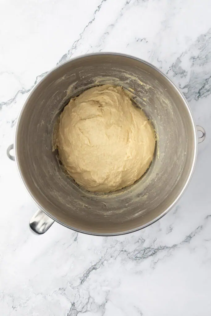 cinnamon roll dough kneaded smooth in a bowl