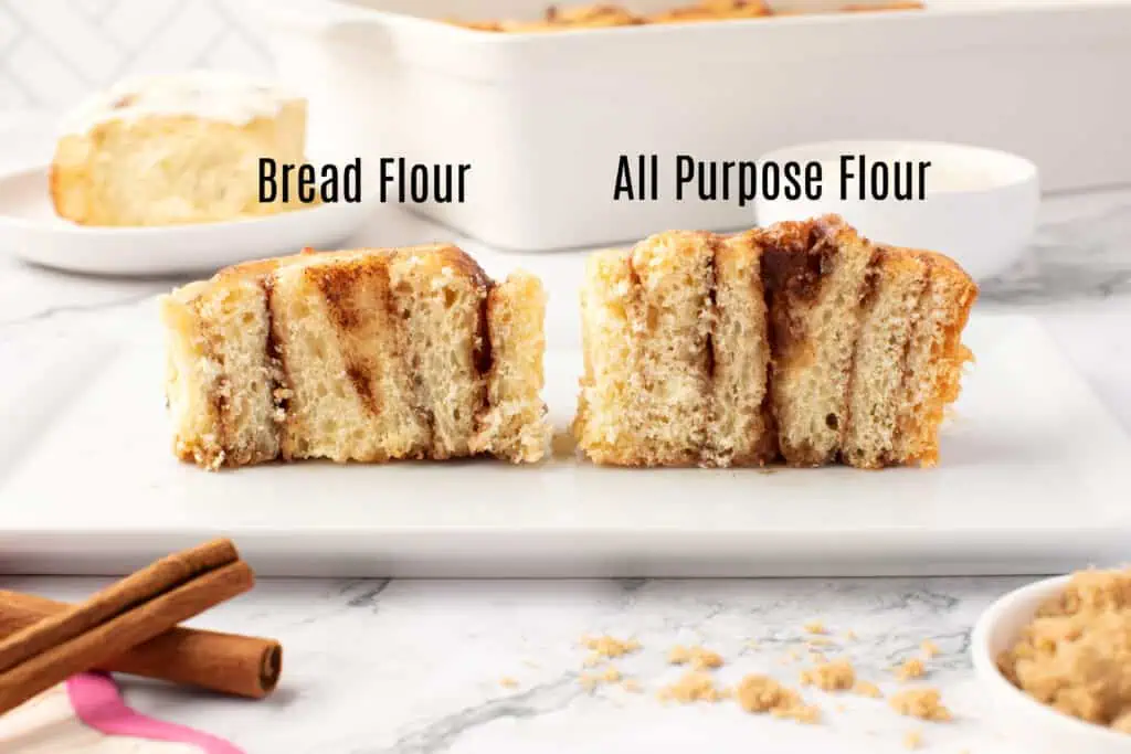two cinnamon rolls, one with bread flour, one with all purpose flour, cut in half