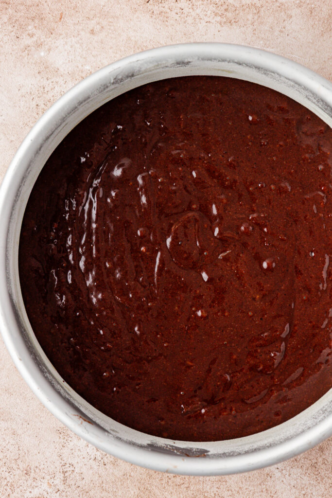 chocolate orange cake batter in a cake pan