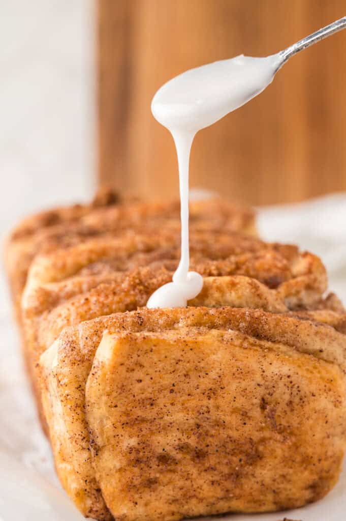 glaze drizzled on top of the cinnamon pull apart bread