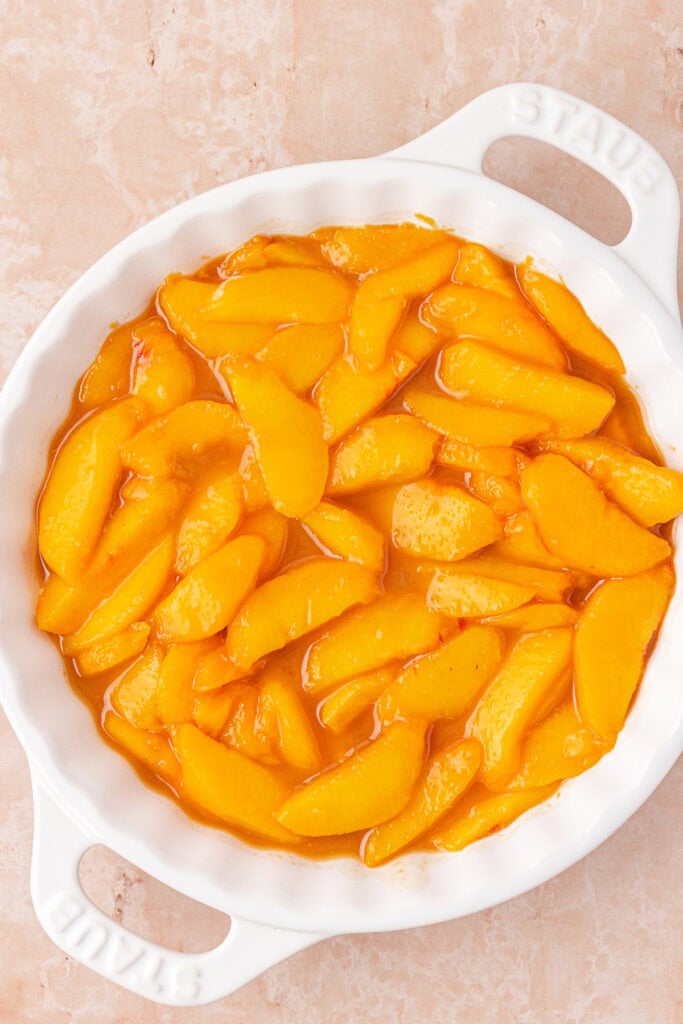 peach filling added to baking dish