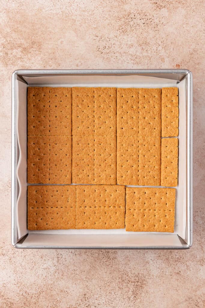 graham crackers placed into the bottom of the square pan