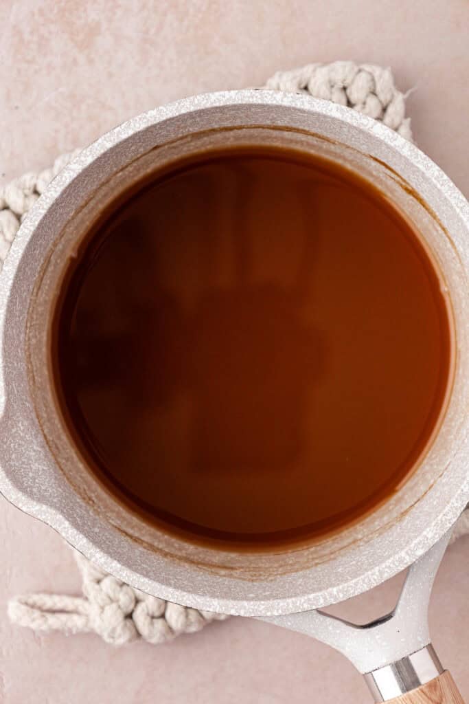 apple cider reduction in a saucepan
