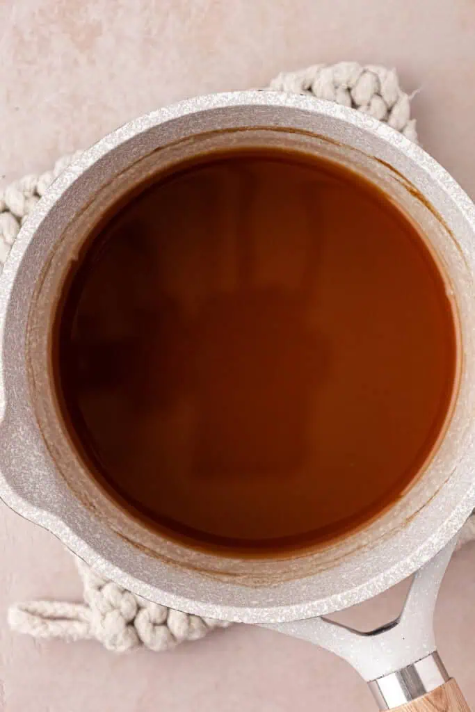 apple cider reduction in a saucepan