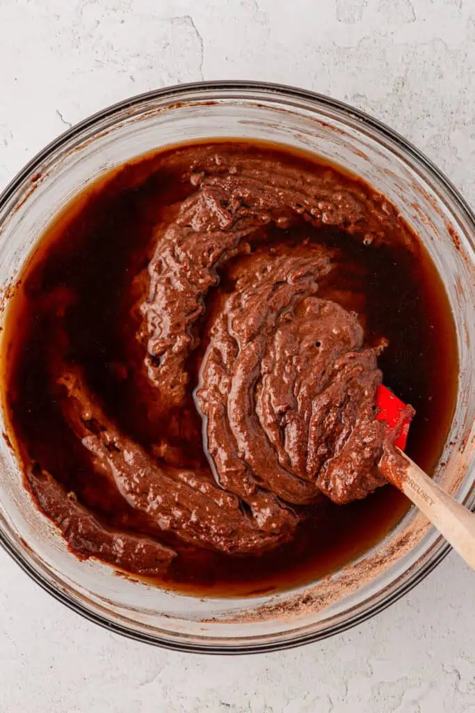 hot coffee stirred into chocolate cake batter