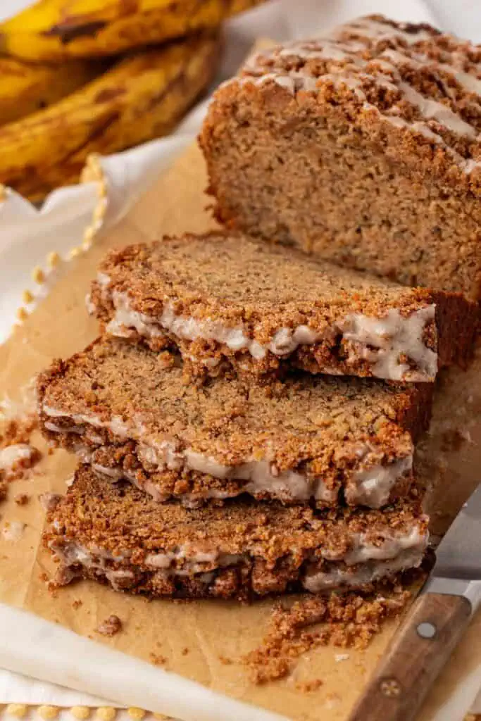 browned butter banana bread with three slices cut