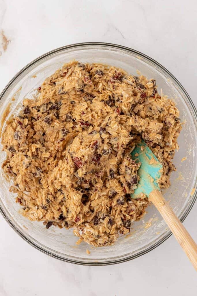 pecans, chocolate chips, and coconut stirred into cookie dough