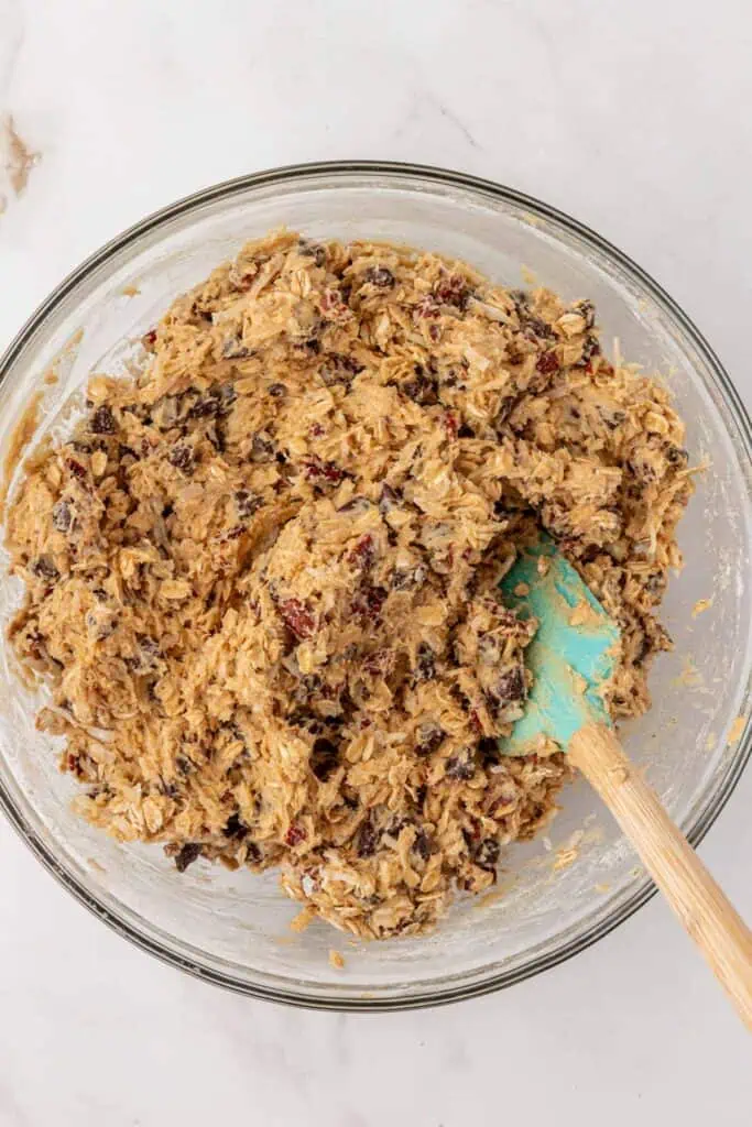 pecans, chocolate chips, and coconut stirred into cookie dough