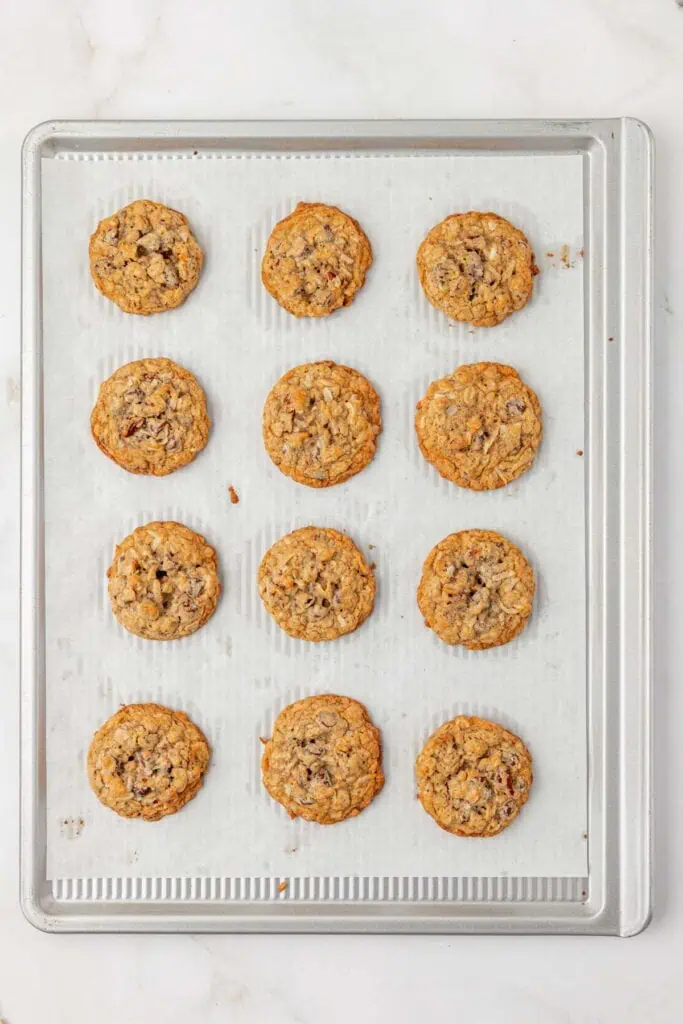 baked cowboy cookies on a cookie sheet