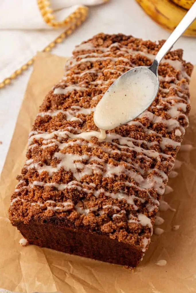 glaze drizzled over the banana bread