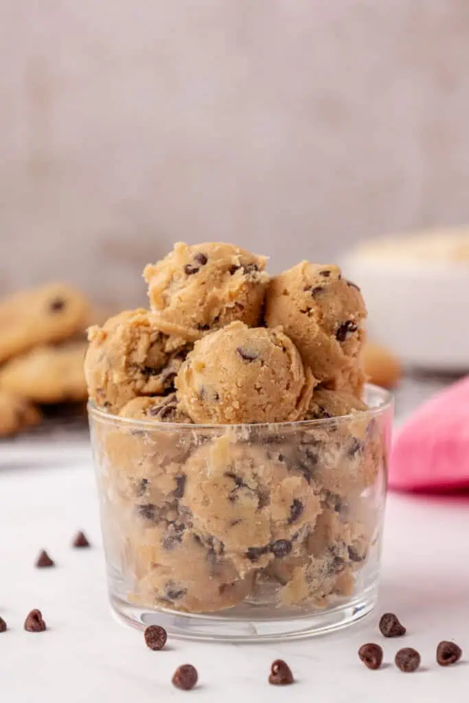 a glass bowl of edible cookie dough balls