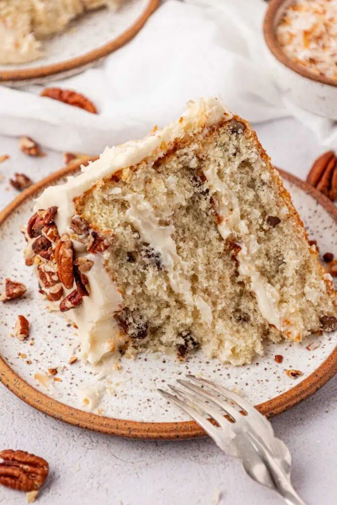 slice of Italian cream cake with a bite missing