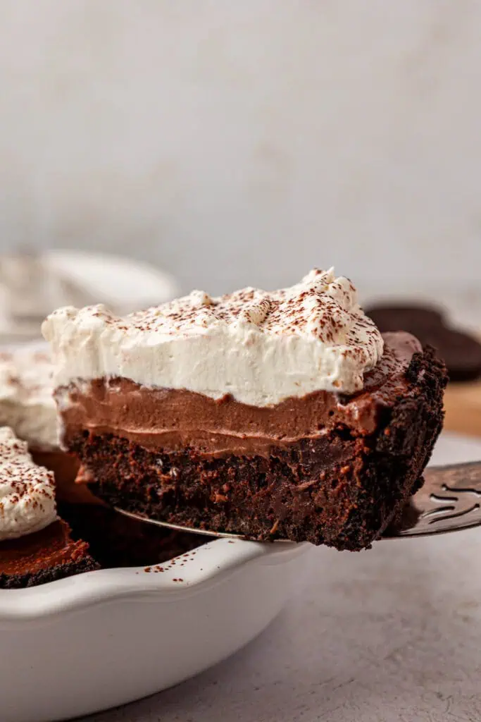 slice of mississippi mud pie being removed on a cake server