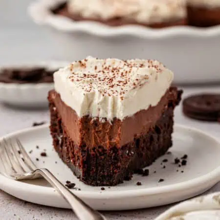 slice of mississippi mud pie on a plate with a forkful missing