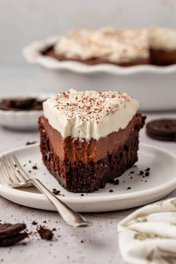 slice of mississippi mud pie on a plate with a forkful missing