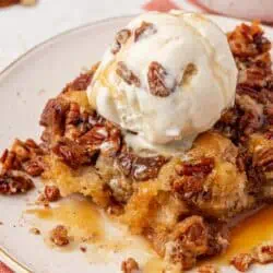 a scoop of pecan pie cobbler with ice cream on top