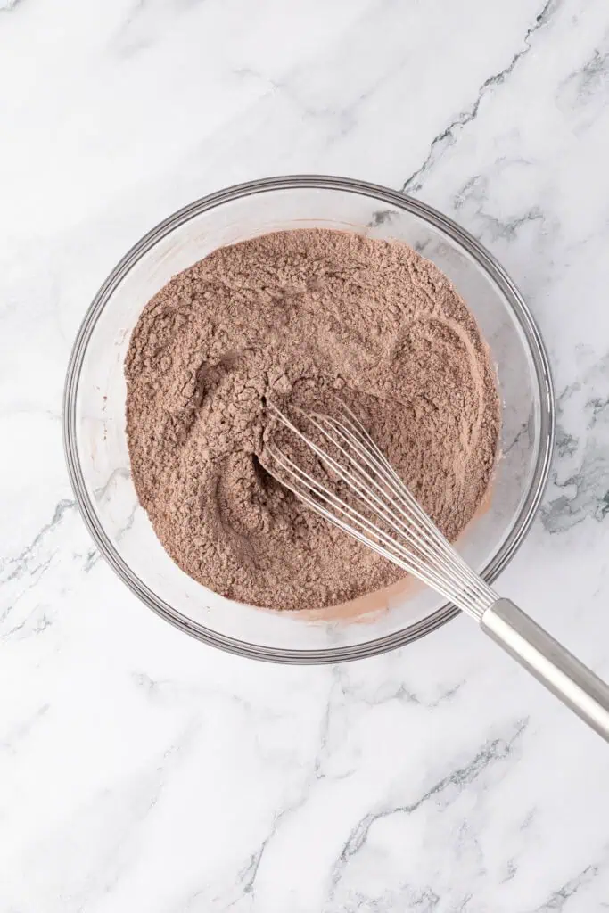 dry ingredients for cookies in a bowl with a whisk