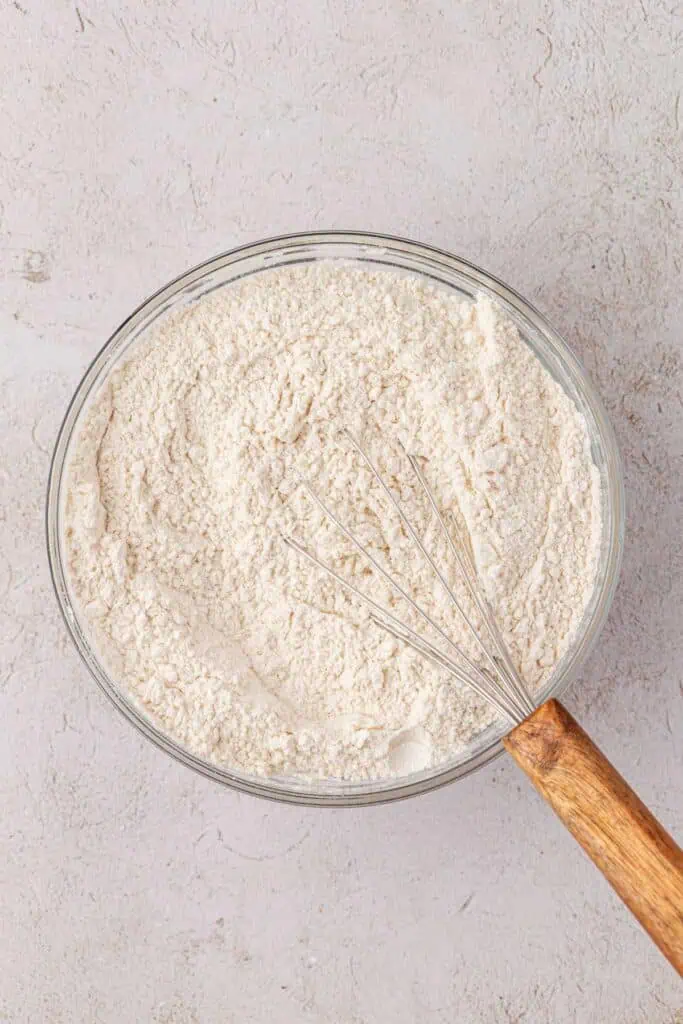 cake dry mix in a bowl with a whisk