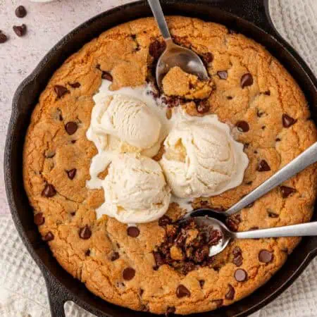 pizookie toppd with icecream and spoons dug into it