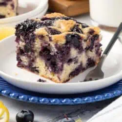 slice of blueberry breakfast cake on a plate