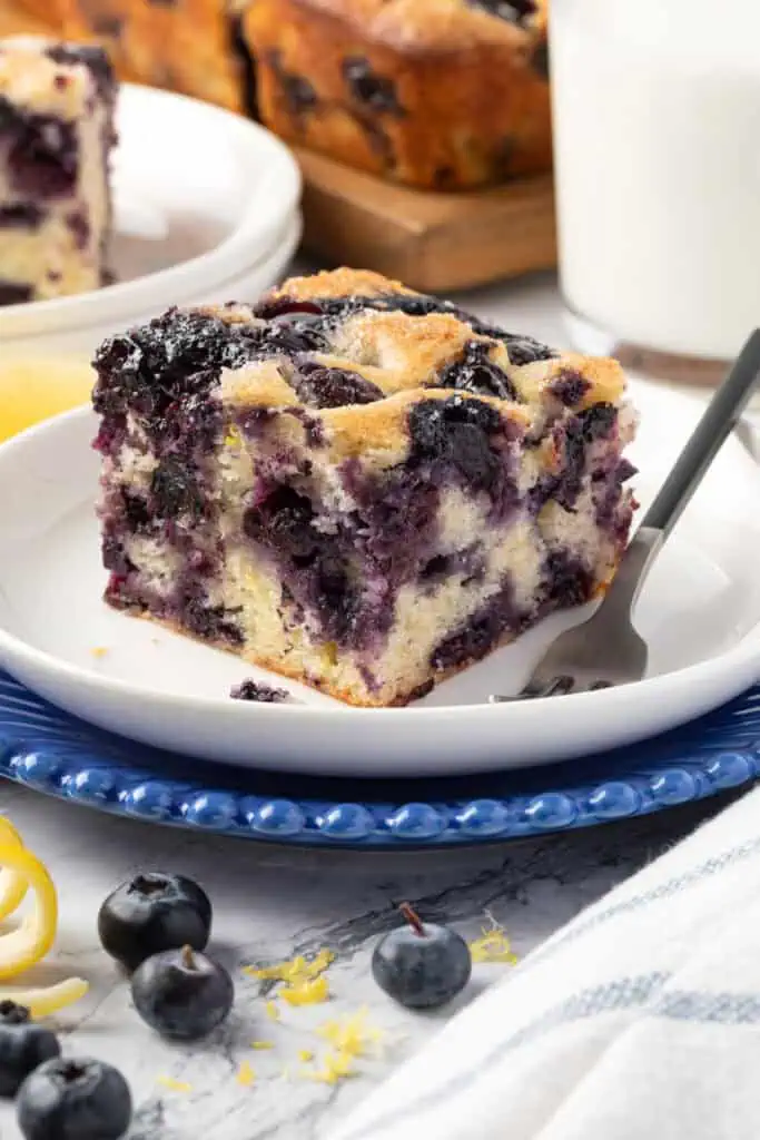 slice of blueberry breakfast cake on a plate