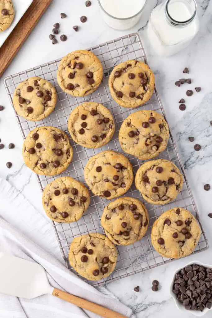 cheesecake stuffed cookies baked on a wire rack