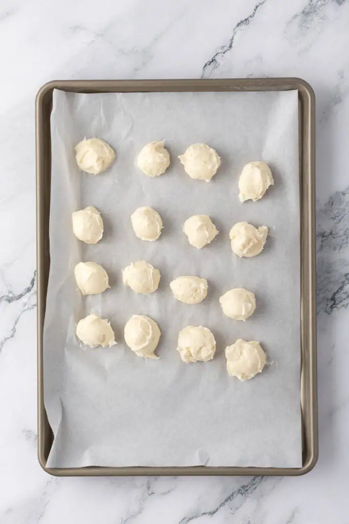 cheesecake stuffed centers on a cookie sheet