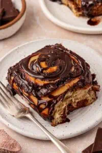 chocolate roll on a plate with a fork