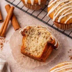 cinnamon roll muffin with a big bite missing