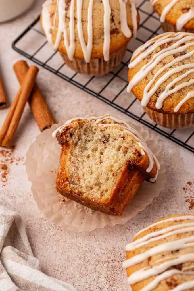cinnamon roll muffin with a big bite missing