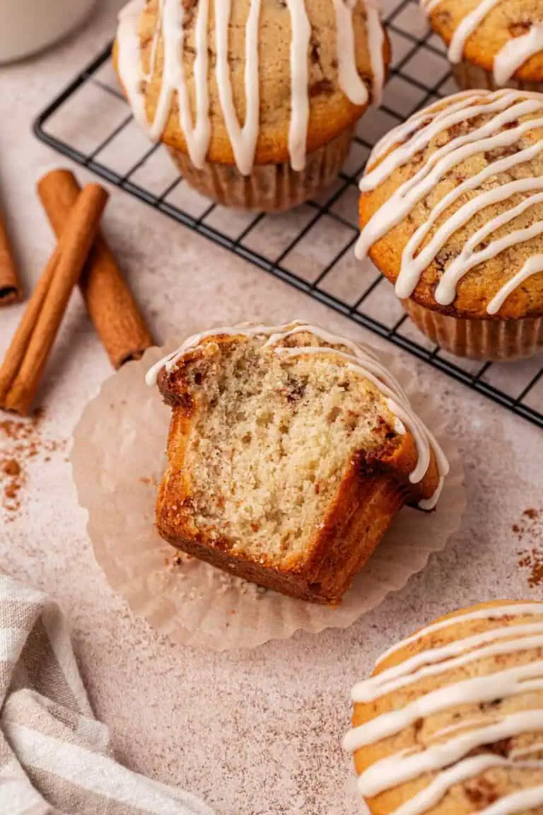 cinnamon roll muffin with a big bite missing