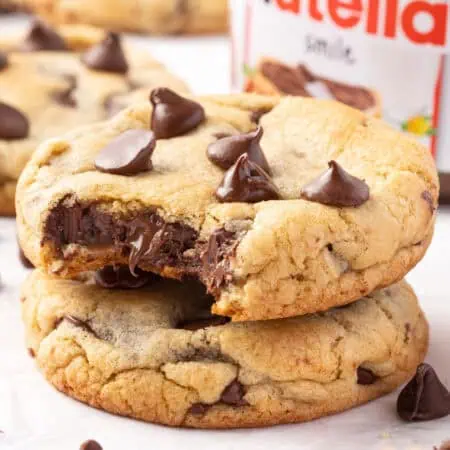 two nutella stuffed chocolate chip cookies stacked