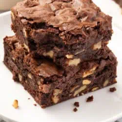 two walnut brownies stacked on top of each other