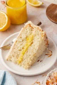 slice of lemon coconut cake on a plate
