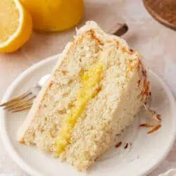 slice of lemon coconut cake on a plate
