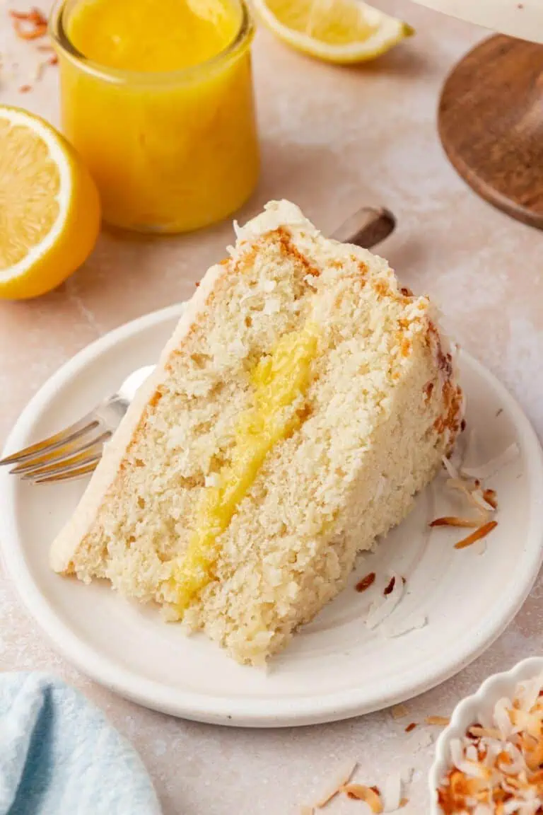 slice of lemon coconut cake on a plate