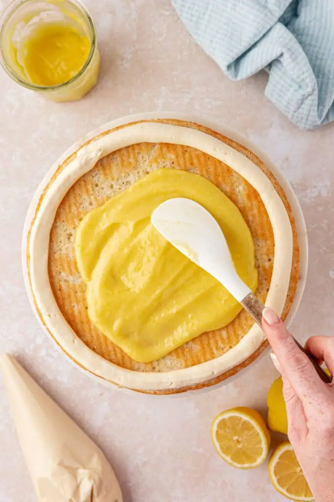 lemon curd spread onto the cake