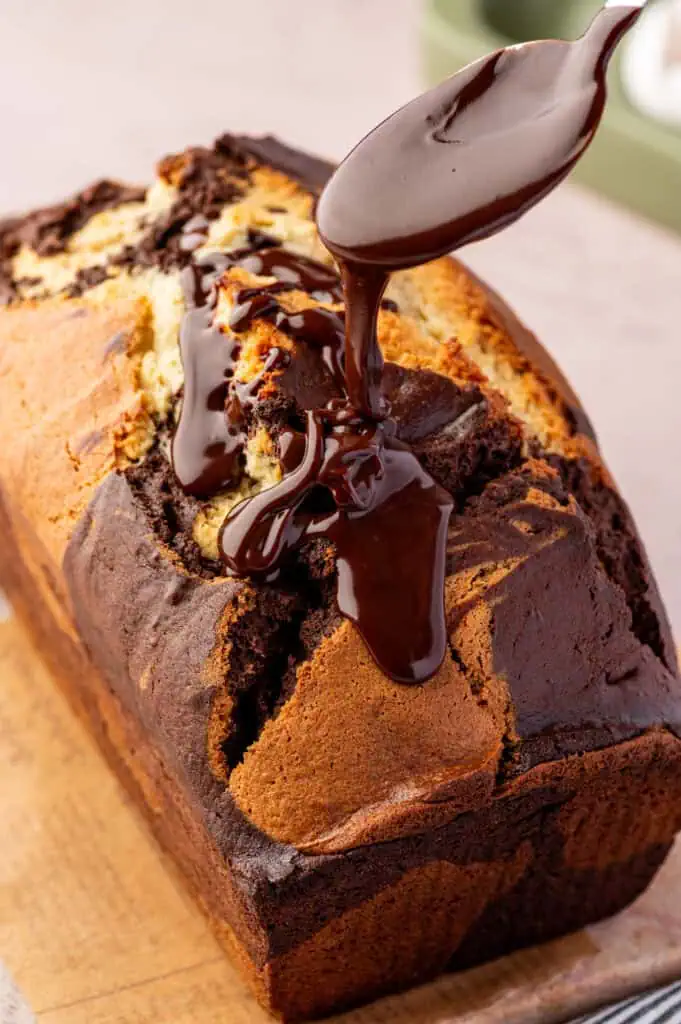 ganache poured over the cake