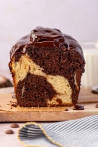 marble loaf cake cut in half on a cutting board