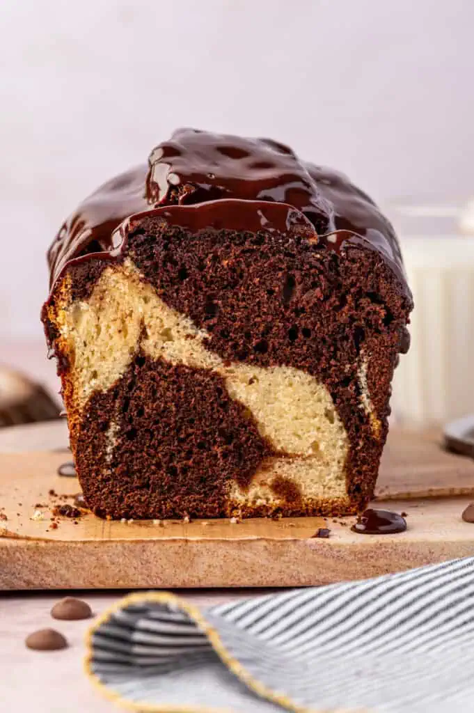 marble loaf cake cut in half on a cutting board