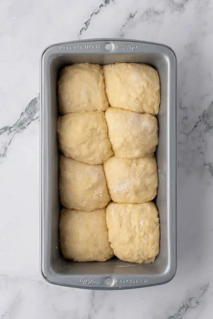 brioche shaped into eight balls and placed into a loaf pan