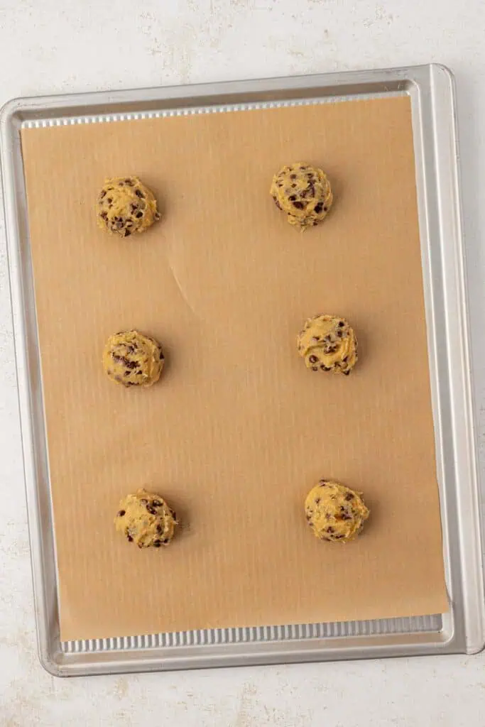 six cookies on a cookie sheet