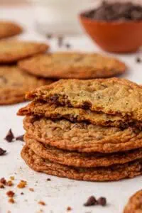 a stack of thin chocolate chip cookies
